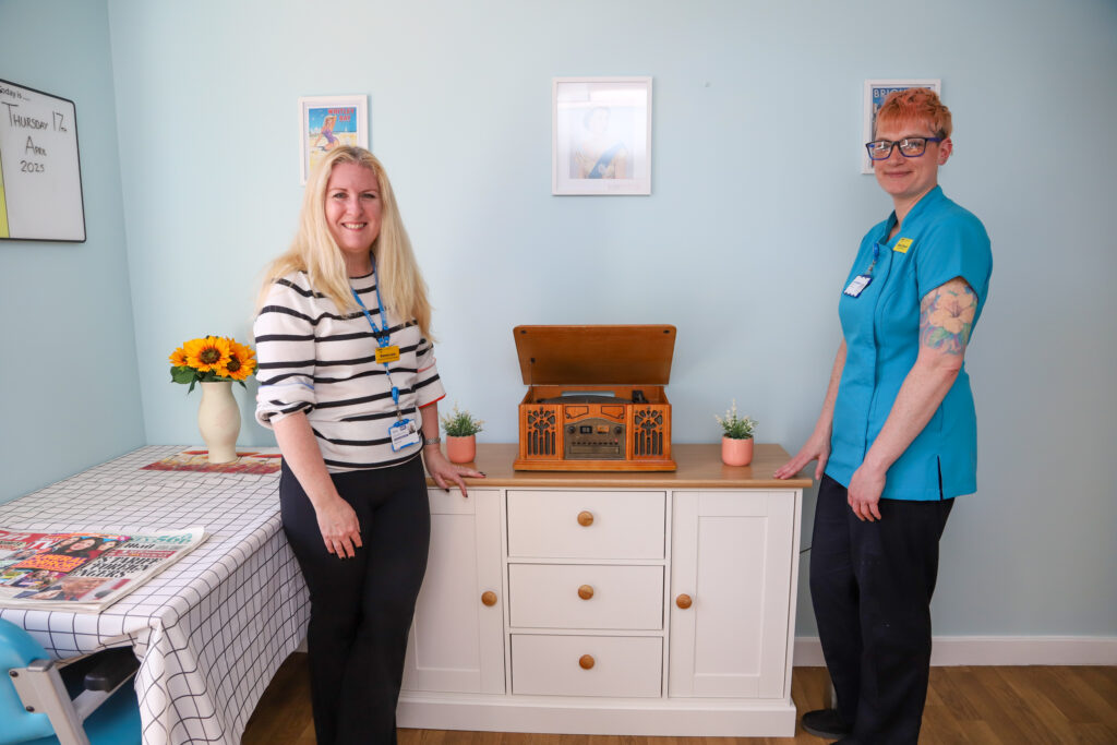 Donna Law, Head of The Medway Hospital Charity and Emily Brown, Namaste Care Practitioner inside the new Namaste Care Room on Tennyson Ward
